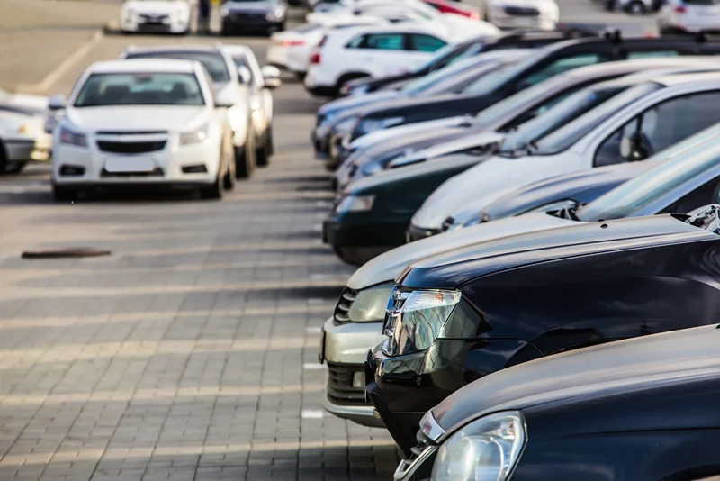 Rows of parked vehicles in a lot, junk car removal service in Mississauga, Ontario